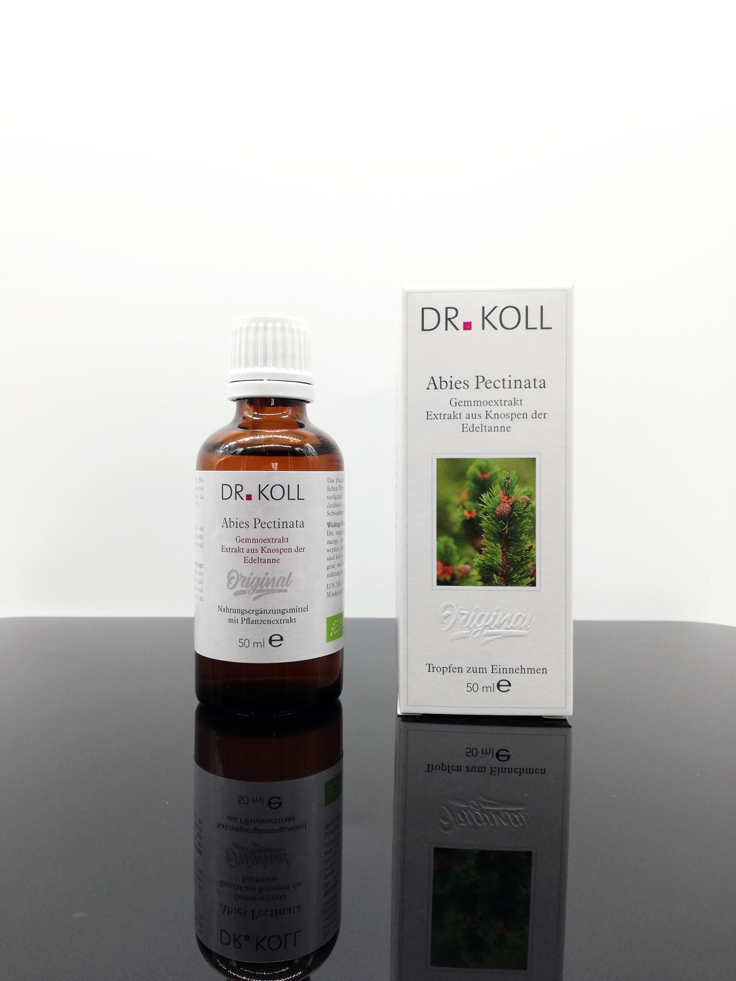 Braunglasflasche mit Tropfen von Dr. Koll und Verpackung mit der Aufschrift "Abies Pectinata".