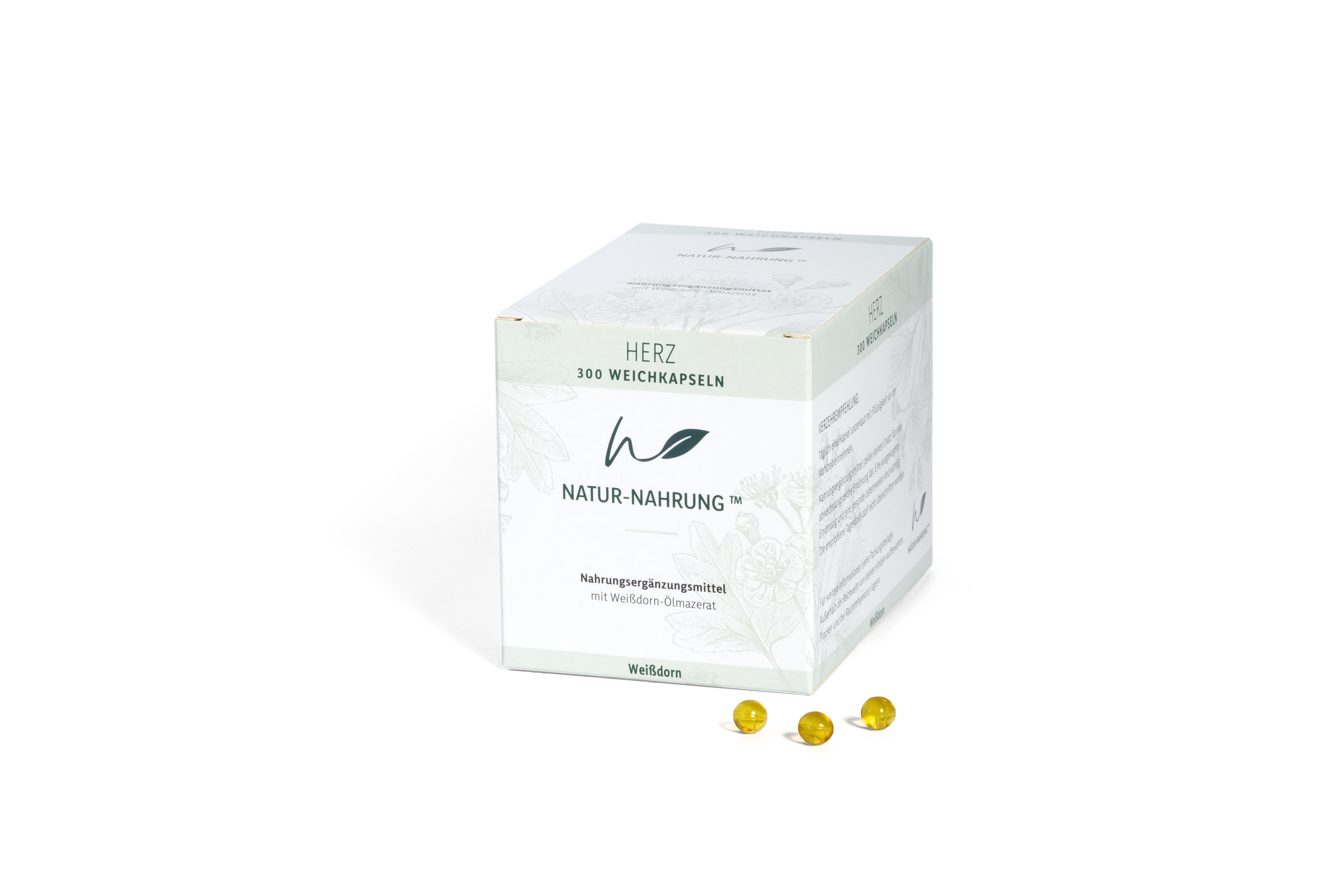 Produktpackung mit dem Aufdruck "HERZ" und drei gelben Weichkapseln auf schwarzem Hintergrund.