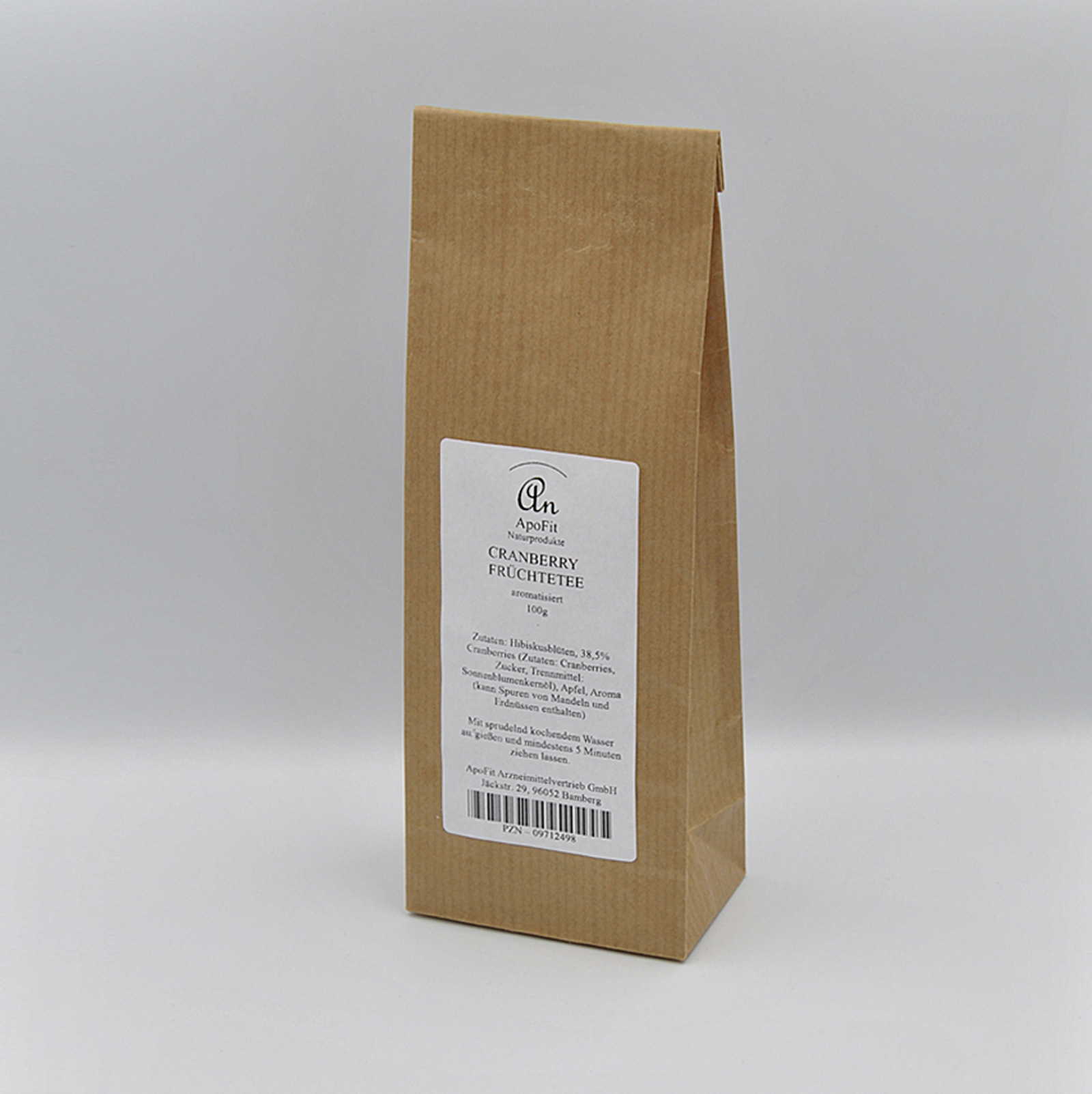 Papiertüte mit Cranberry-Früchtetee und Zutatenangaben auf dem Etikett.