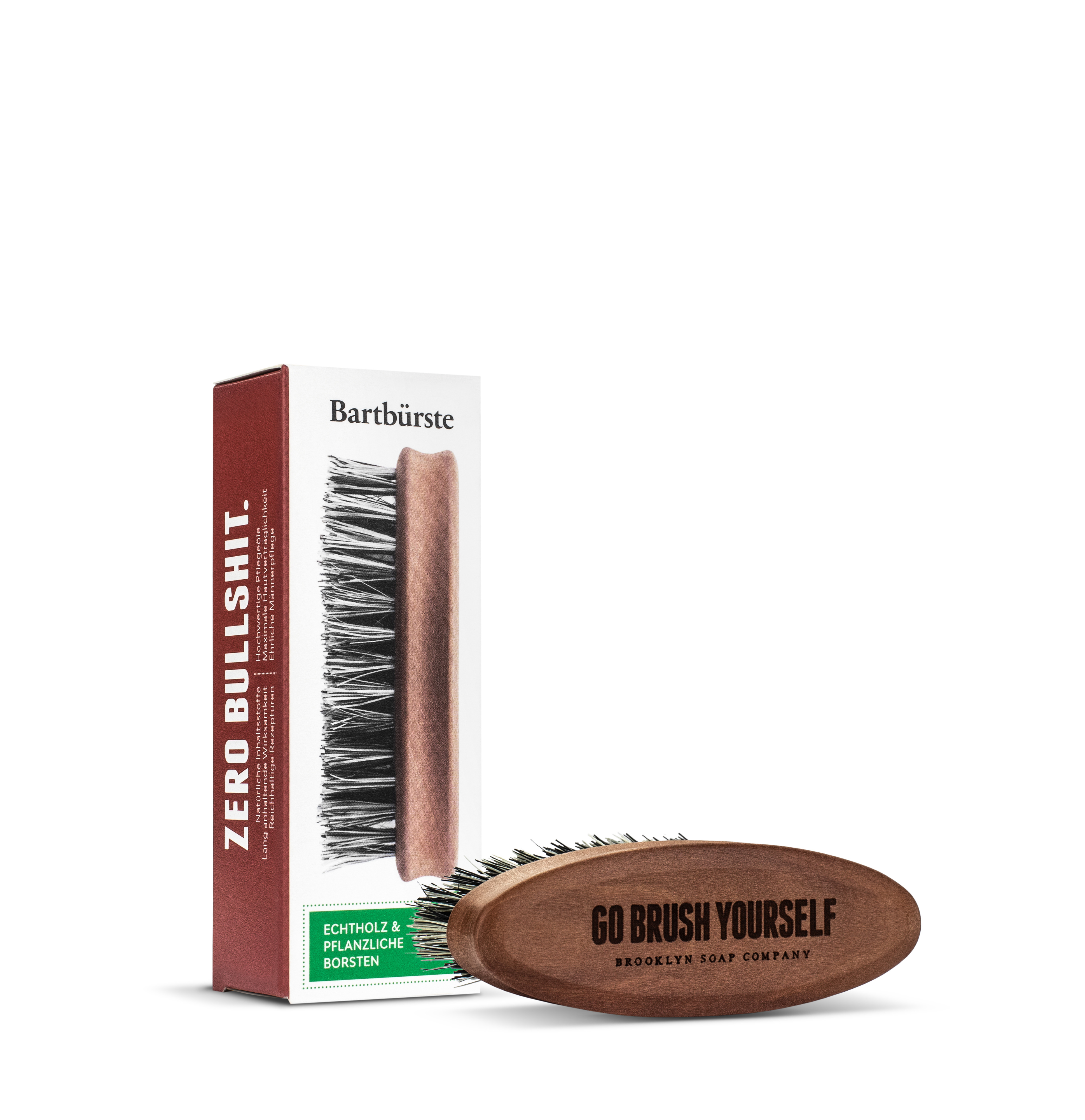 Bartbürste mit Holzkörper und Verpackung, beschriftet mit "ZERO BULLSHIT" und "GO BRUSH YOURSELF".