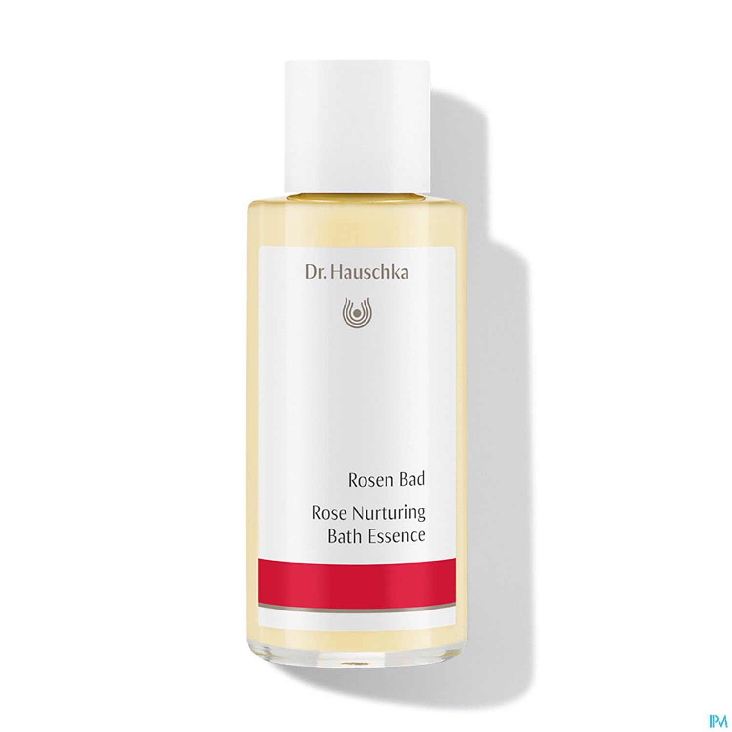 Flasche mit Dr. Hauschka Rosen Bad, einer Badeessenz in gelber Flüssigkeit mit weißem Deckel und rotem Etikett.