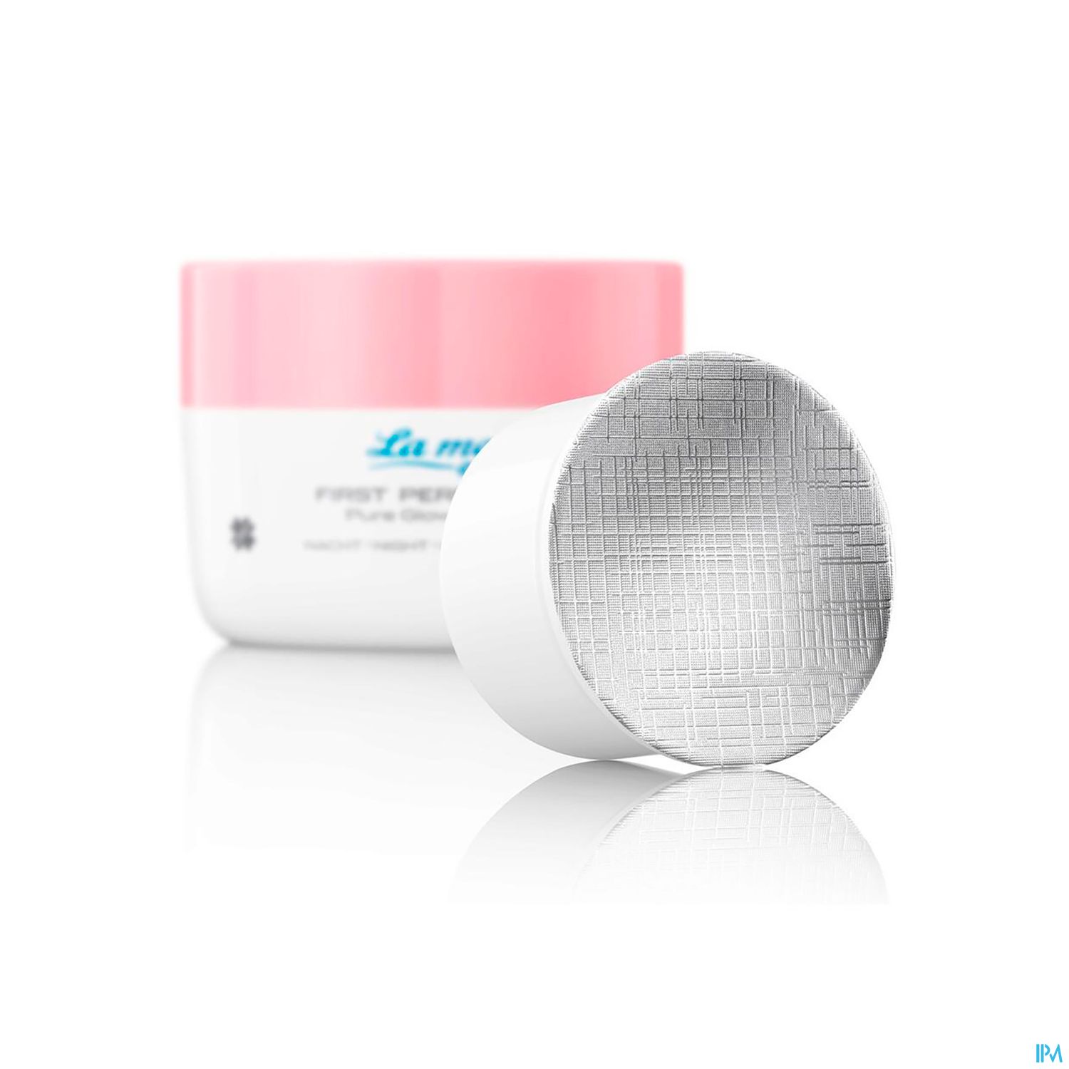 Eine geöffnete Creme-Dose mit einem weißen und rosa Deckel, mit dem Text "La mer FIRST PERFECTING SERUM" auf dem Behälter.