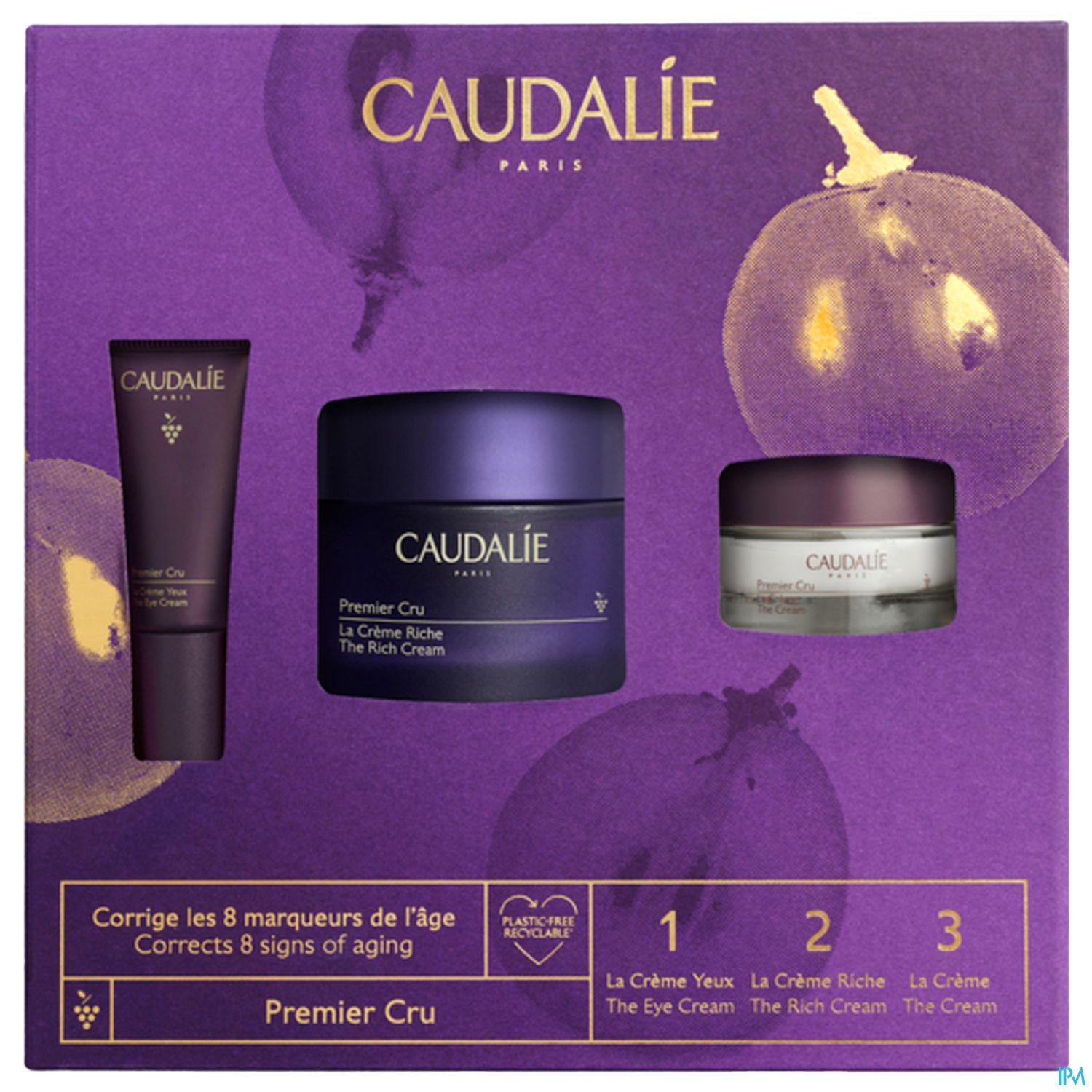 Produktverpackung von Caudalie mit drei Anti-Aging-Cremes auf lila Hintergrund.