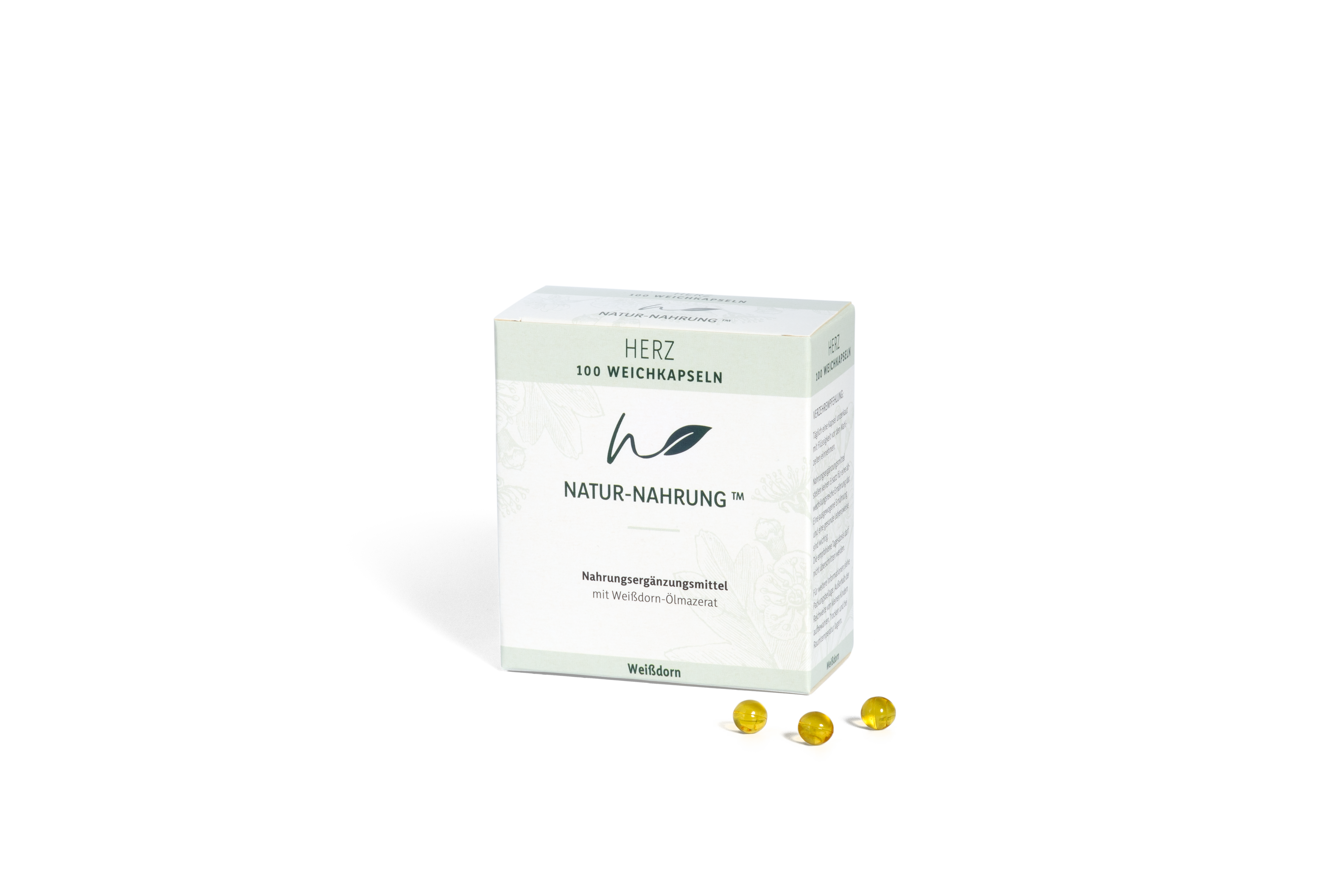 Verpackung von Nahrungsergänzungsmitteln mit drei gelben Weichkapseln daneben.